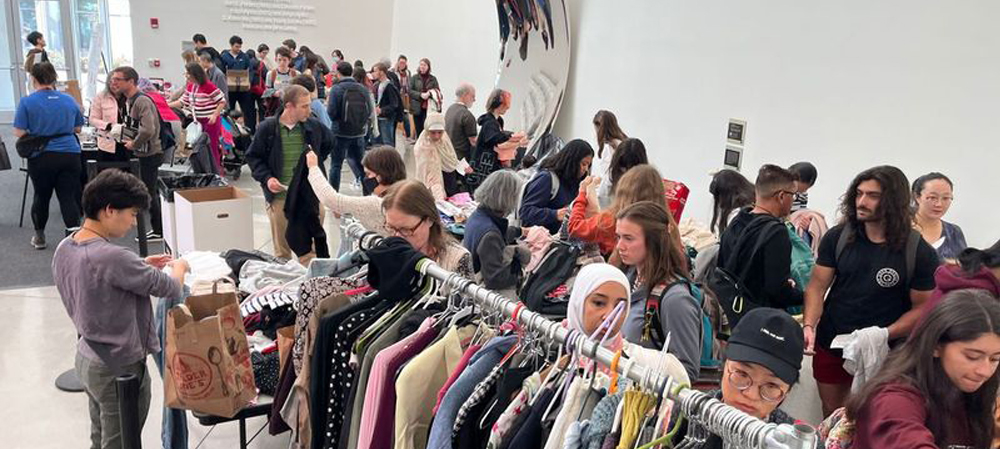 People browsing used goods at a Working Green event